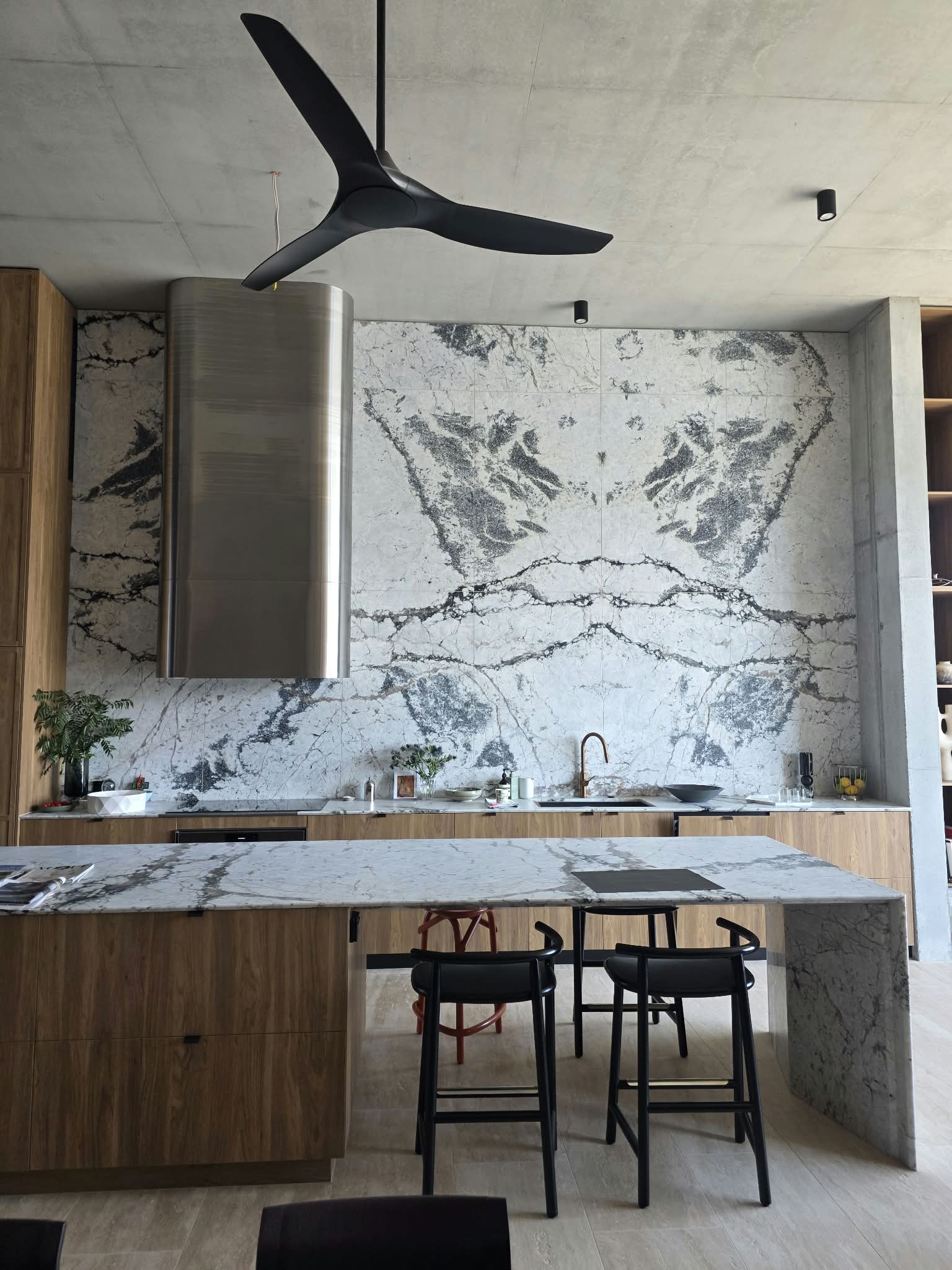 Granite kitchen island and full-height splashback, fabricated by APD