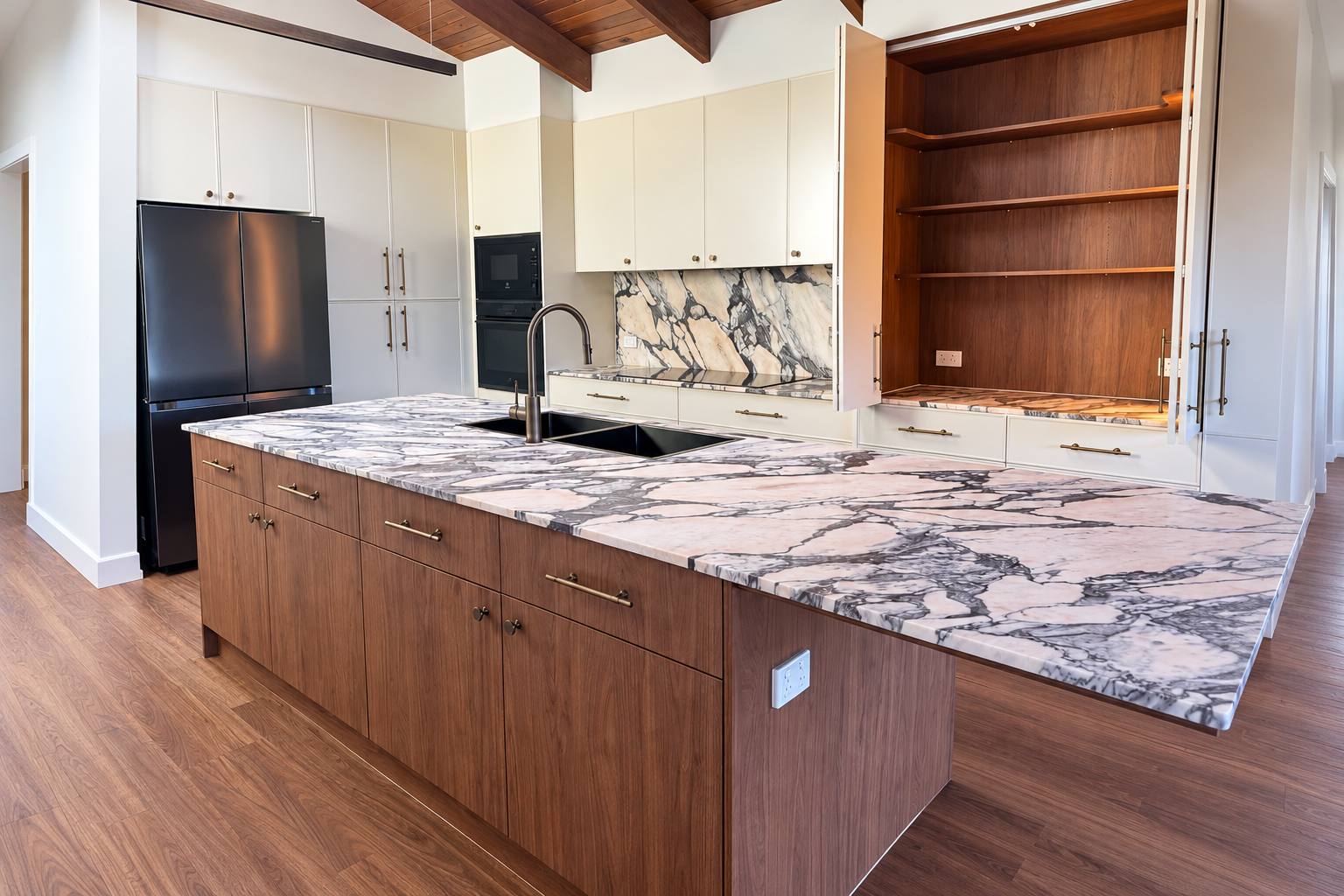 Marble kitchen island benchtop with bold purple veining, fabricated by APD